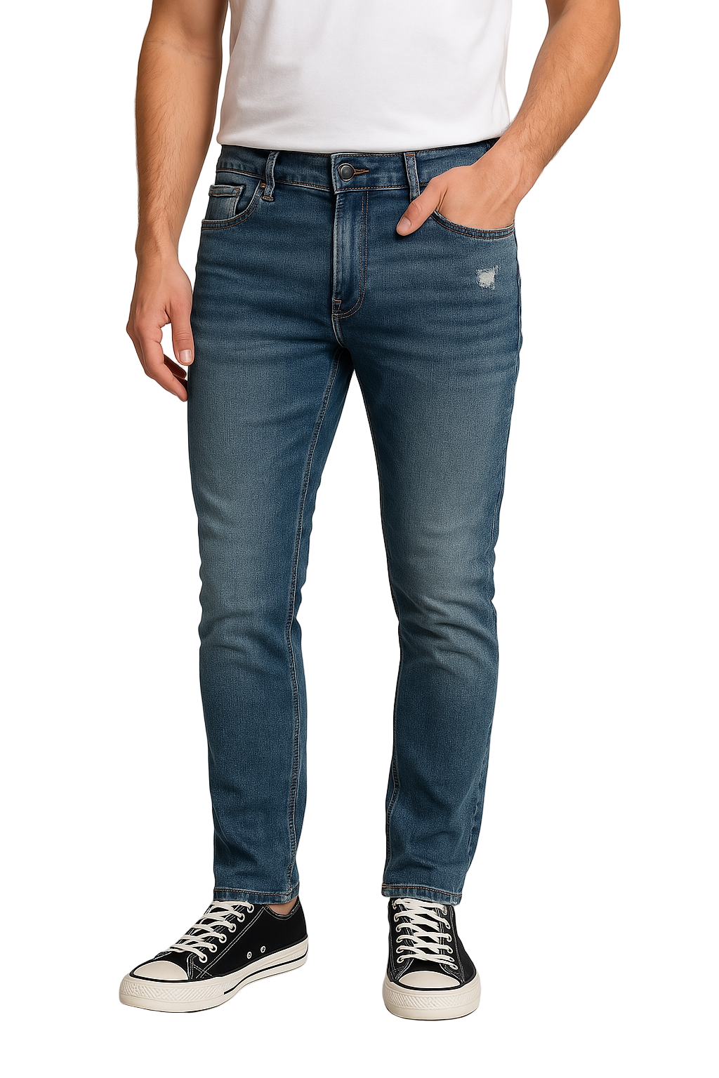 Person wearing blue jeans and black sneakers on a plain background