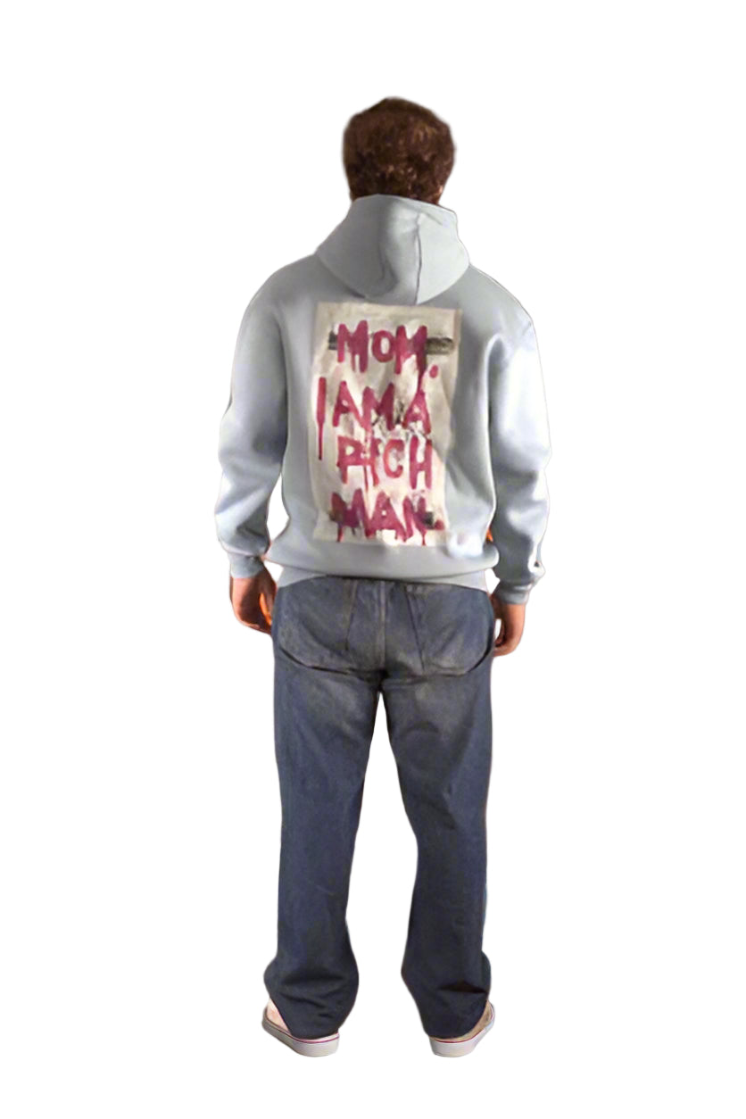 Person wearing a hoodie with text on the back, standing against a white background
