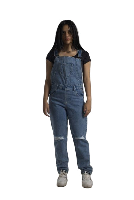 Person wearing blue denim overalls on a plain background