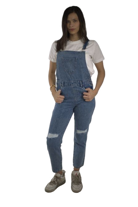 Person wearing a denim overalls and white shirt on a plain background