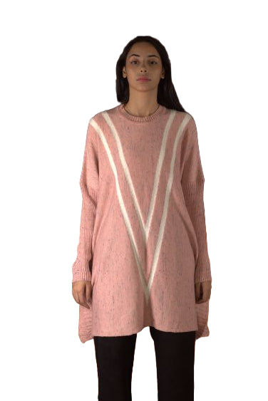 Person wearing a pink sweater with white stripes on a dark background
