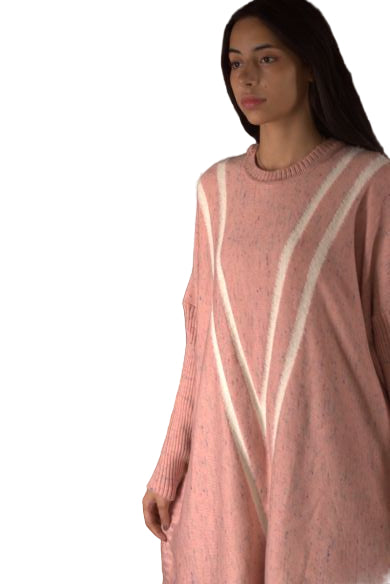 Woman wearing a pink sweater with white stripes lying on a brown couch.